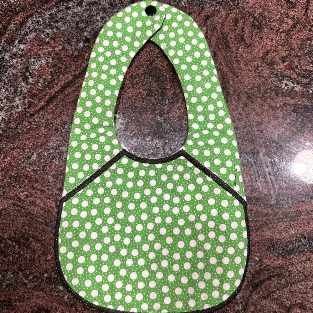 Handmade reversible quilted baby bib in Boston Celtics print